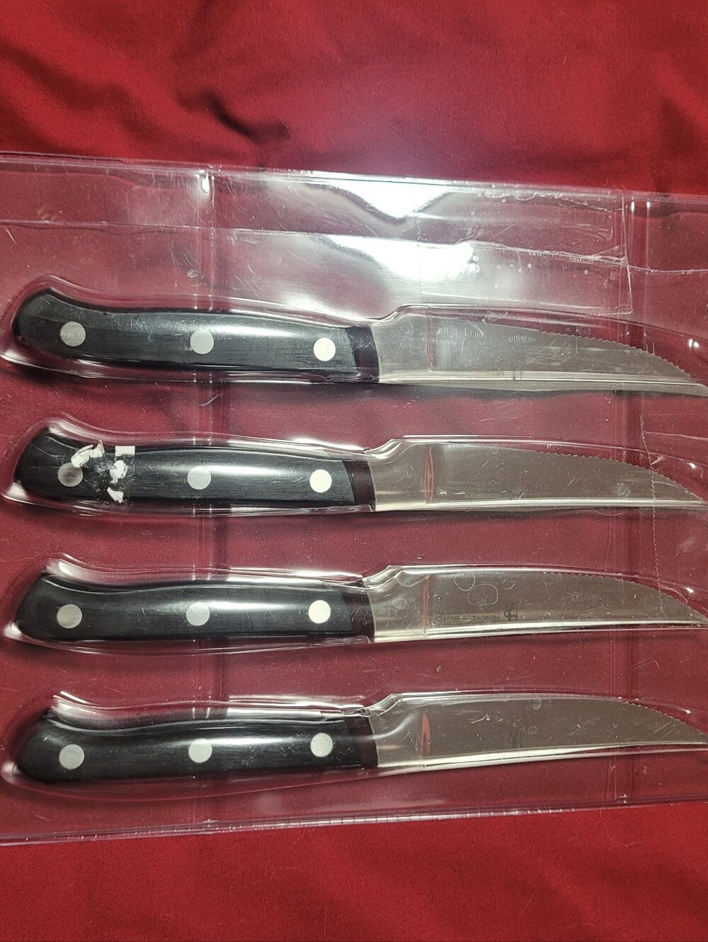 Set of 4 Serrated Steak Knives with Black Riveted Handles Henckels